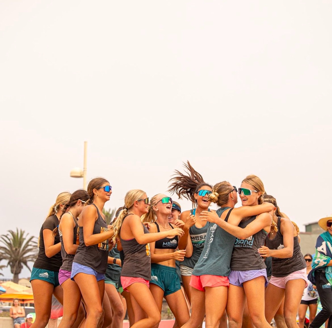 Beach volleyball team huddle